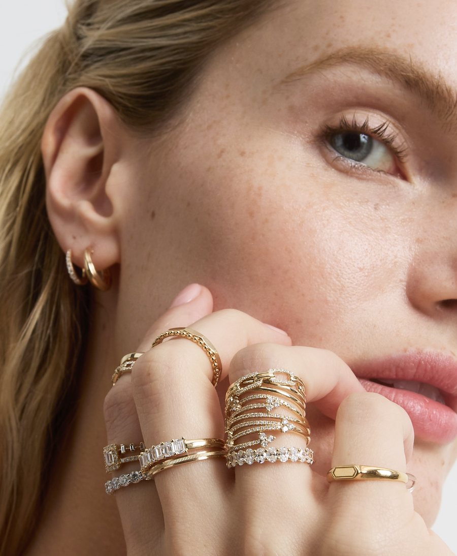 Model with stacked diamond and gold rings