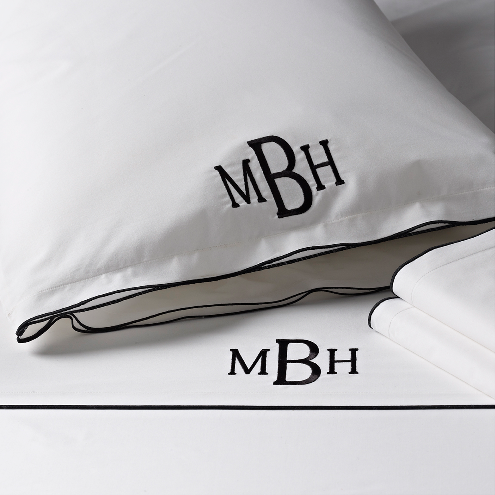 White pillowcase with black piping, MBH monogram